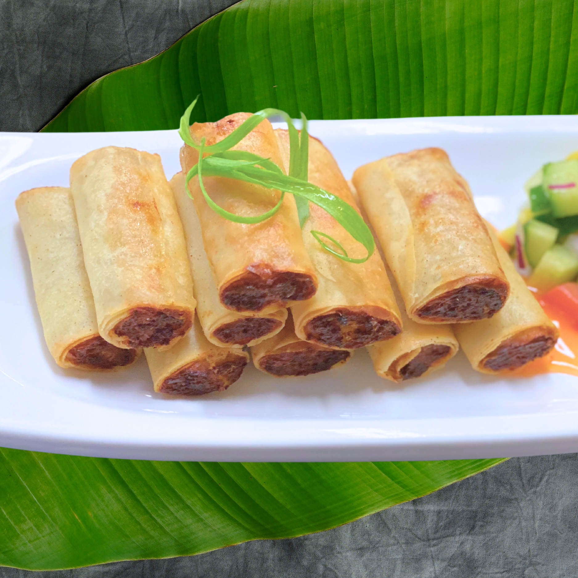 Lumpia Shanghai - Crispy Filipino spring rolls filled with savory pork and vegetables